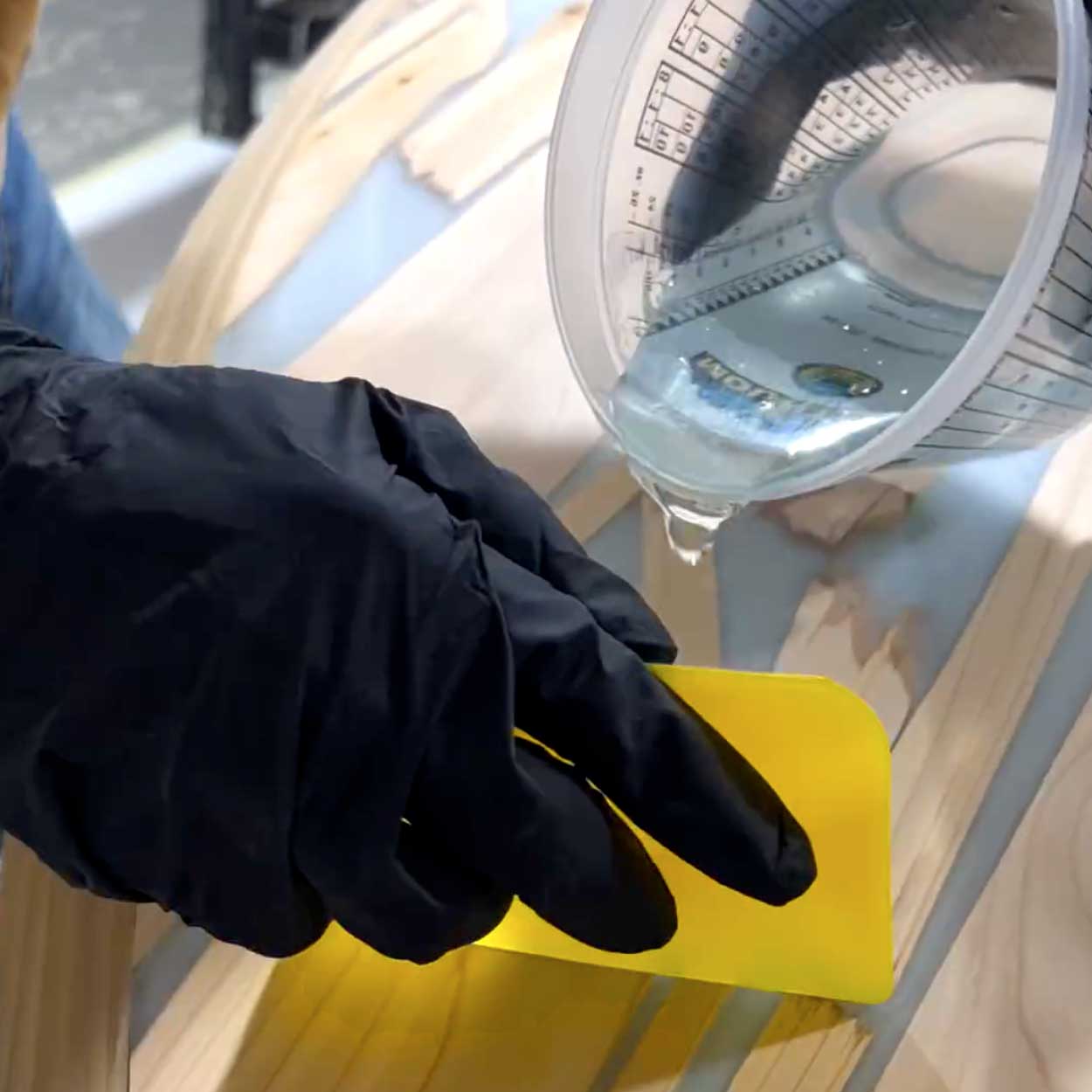 wood paddleboard being glassed