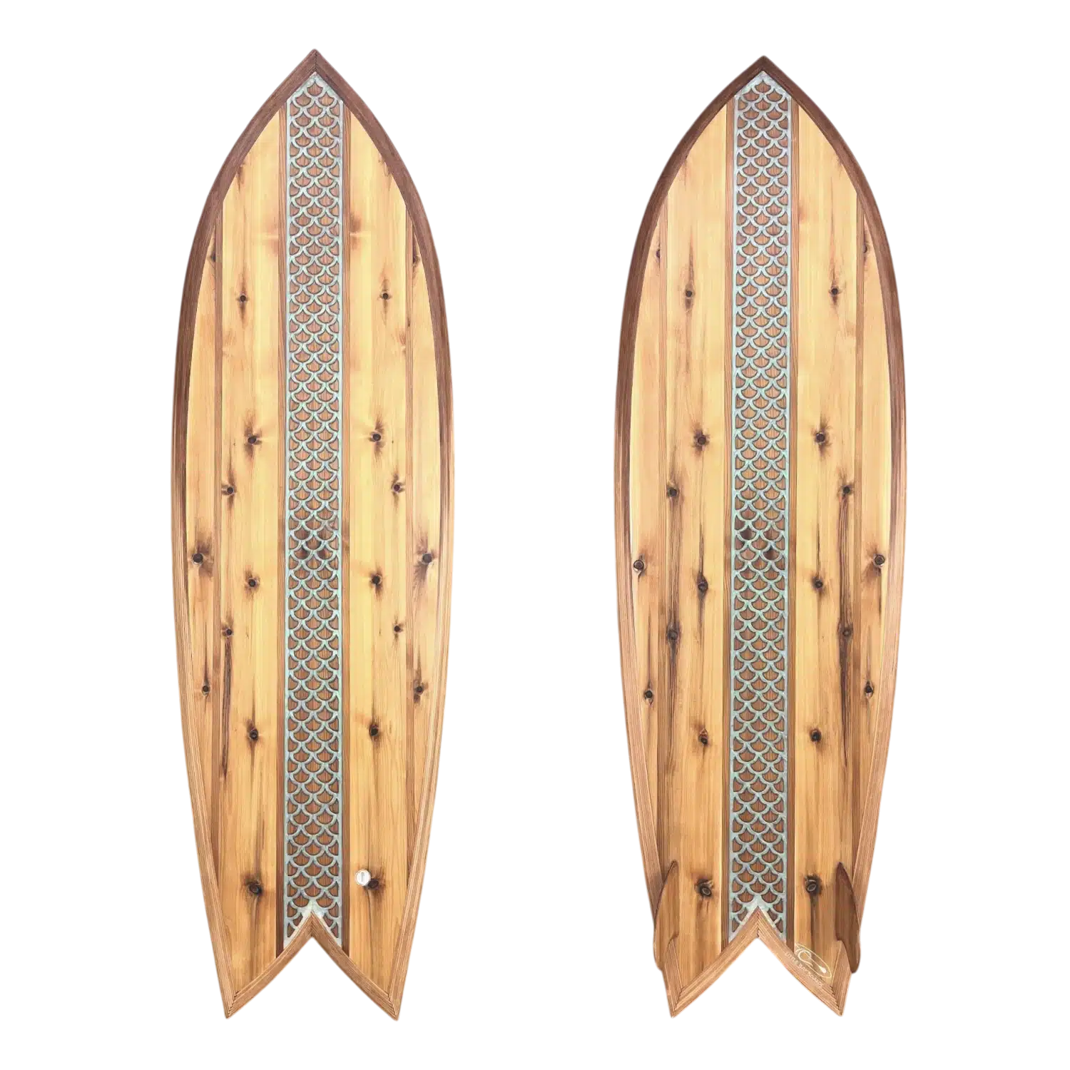 Wooden surfboards with mermaid fish scale designs.